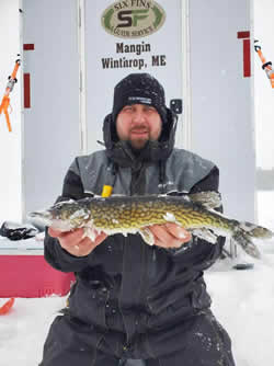 Man with Chain Pickerel he caught.