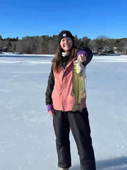 Happy woman holding a Largemouth Bass.