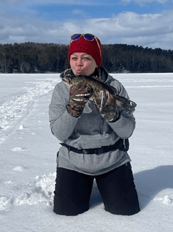 Woman holding a Largemouth Bass.